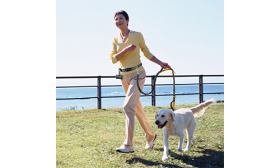 Hands Free Running Retractable Dog Leash Woman running with a dog using a orangehands free running retractable dog leash, adjustable belt, padded handles.